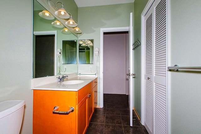 Bathroom floor and cabinets photo enhanced